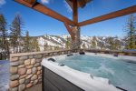 Relax and take in the mountain views from the oversized private hot tub.